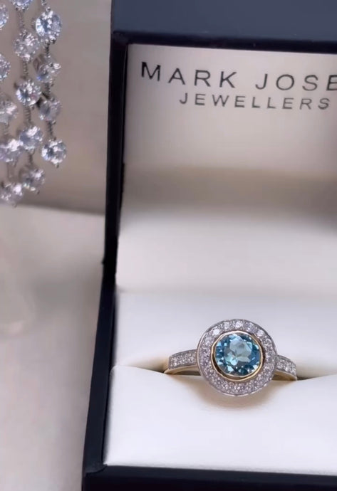 9CT GOLD BLUE TOPAZ HALO RING